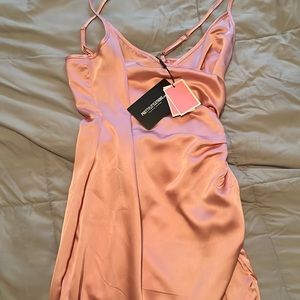 I ordered this dress from PrettyLittleThing. It’s a size 2 and is pink.